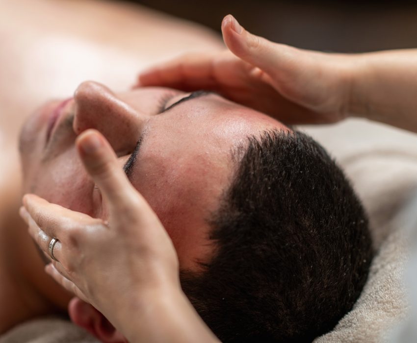 Rejuvenating face massage for men, focusing on relieving tension,